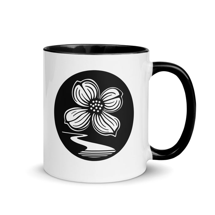 Dogwood Lane Accent Mug featuring dogwood flower logo on white ceramic with colored accent handle