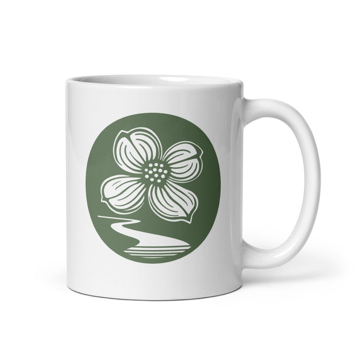 Dogwood Lane Mug featuring dogwood flower logo and winding path design on white ceramic